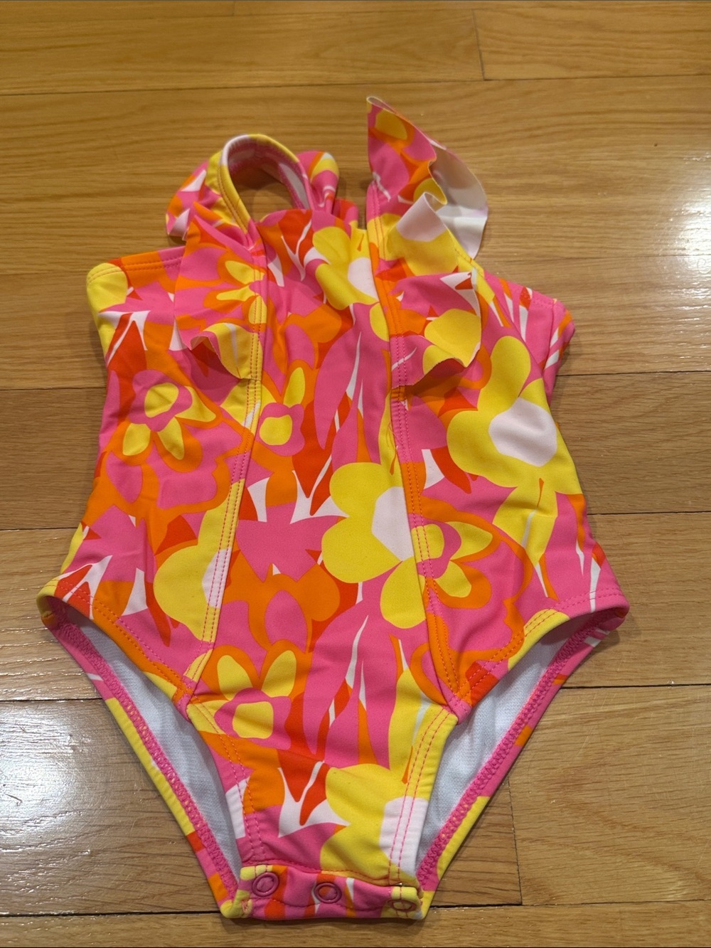 Snapper rock floral with ruffles one piece swimsuit size 18-24. Months .
